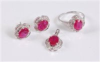 Lot 1189 - A 9ct ruby and diamond suite, the ring set...