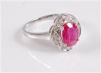 Lot 1189 - A 9ct ruby and diamond suite, the ring set...