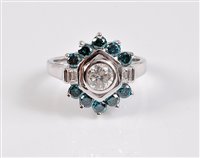 Lot 1163 - A 14ct blue and white diamond ring, the...