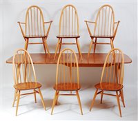 Lot 451 - A 1960s Ercol blond elm dining suite,...