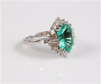 Lot 1217 - An 18ct and platinum emerald and diamond ring,...
