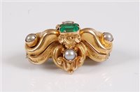 Lot 1181 - An emerald and pearl brooch, the central...