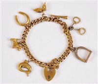 Lot 1198 - A 9ct charm bracelet of sporting interest, the...