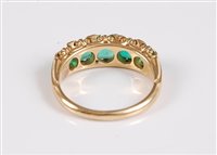 Lot 1179 - A five stone emerald ring, the five graduated...