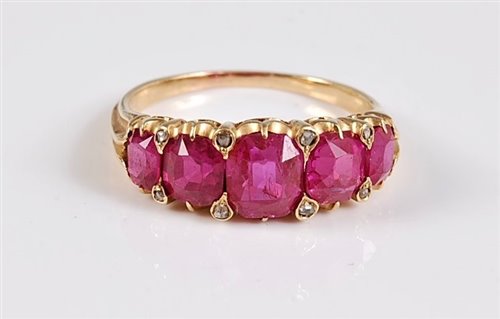Lot 1180 - A five stone ruby ring, the five graduated...