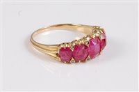 Lot 1180 - A five stone ruby ring, the five graduated...