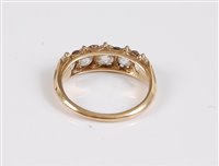 Lot 1209 - A five stone diamond ring, the five graduated...