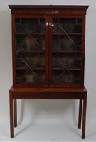 Lot 1573 - *An Edwardian mahogany bookcase on stand, the...