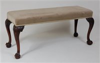 Lot 1569 - *A Georgian style mahogany duet stool, having...