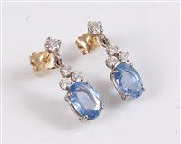 Lot 1165 - A pair of 18ct sapphire and diamond earrings,...