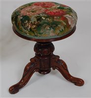 Lot 1584 - *A Victorian rosewood pedestal piano stool,...