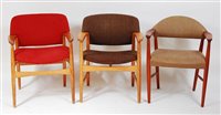Lot 419 - Two 1960s Danish oak framed elbow chairs, each...
