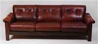 Lot 409 - A 1970s Danish tan leather three-seater sofa,...