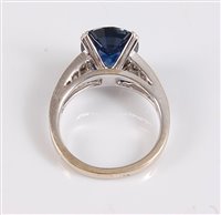 Lot 1159 - An 18ct sapphire and diamond ring, the oval...