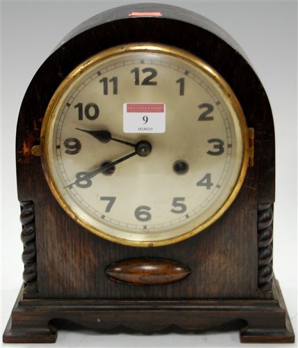 Lot 9 - A 1920s oak cased dome top mantel clock having...