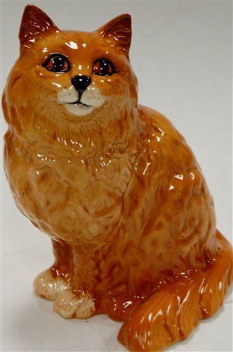 Lot 11 - A Beswick model of a cat in seated pose...