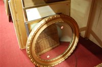 Lot 1086 - A gilt framed and bevelled oval wall mirror;...