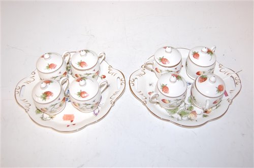 Lot 134 - A set of four Coalport strawberry pattern cups...