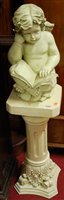 Lot 1135 - A contemporary resin figure of a winged putti,...