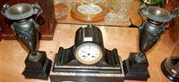 Lot 153 - A Victorian slate mantel clock having a bronze...