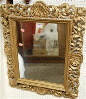 Lot 1164 - A gilt framed plaster rectangular wall mirror,...
