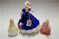 Lot 204 - A Royal Doulton figurine, Mary HN3375; and two...