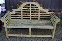 Lot 1169 - A contemporary slatted teak three-seater...