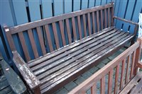 Lot 1182 - A contemporary stained teak and slatted...