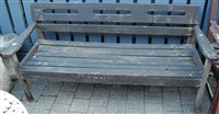 Lot 1183 - A contemporary slatted teak three-seater...