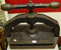 Lot 1195 - A late Victorian cast iron book-press, having...