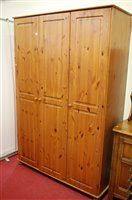 Lot 1222 - A modern pine three door wardrobe, w.137cm