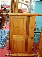 Lot 1234 - A Ducal modern pine double bedstead, having...