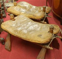 Lot 1252 - A pair of North African walnut, brass studded,...