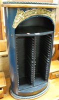 Lot 1267 - A contemporary oak and painted oval CD rack,...