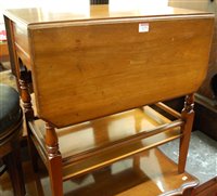 Lot 1275 - An Edwardian walnut dropflap two-tier...