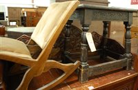 Lot 1297 - A relief carved and joined oak joint stool;...