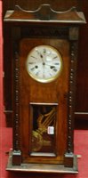 Lot 1304 - An early 20th century oak droptrunk wall clock,...