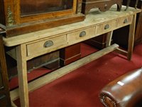 Lot 1312 - A rustic pine long dresser base, having four...