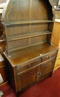 Lot 1313 - A contemporary moulded oak linenfold dome top...