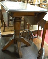 Lot 1342 - A contemporary Ercol dark elm dropflap...