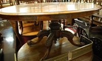 Lot 1346 - A mid-Victorian figured walnut oval tilt-top...