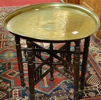 Lot 1349 - An Eastern engraved brass topped circular...