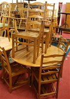 Lot 1332 - A contemporary Ercol mid elm dining suite...