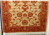 Lot 1217 - A modern cream ground Zieglar rug, 135 x 190cm