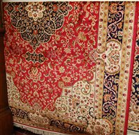 Lot 1219 - A modern Kashan red ground carpet, 280 x 200cm