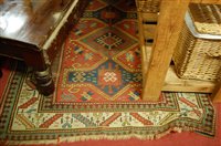 Lot 1208 - A Caucasian woollen carpet, the red ground...