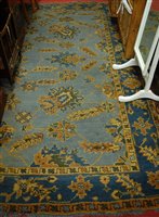 Lot 1209 - A Turkish woollen blue ground carpet, having...