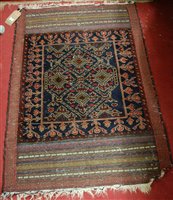 Lot 1212 - A Persian woollen blue ground prayer rug,...