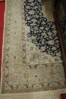 Lot 1203 - A Persian woollen blue ground Tabriz rug,...