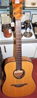 Lot 301 - A Tramontane T66D acoustic guitar; together...